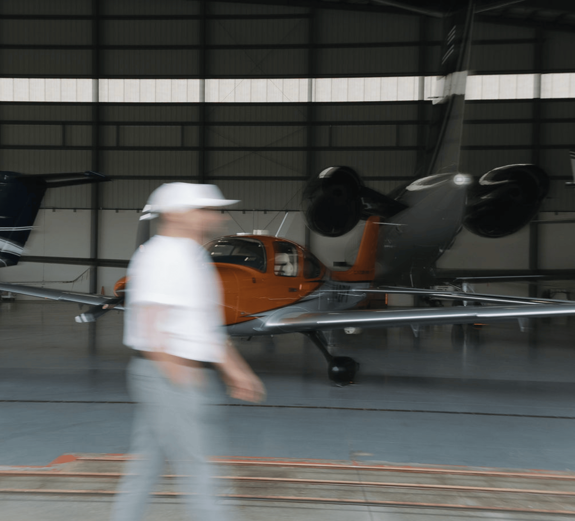 A image of a concrete sphere, balanced between two other larger spheres